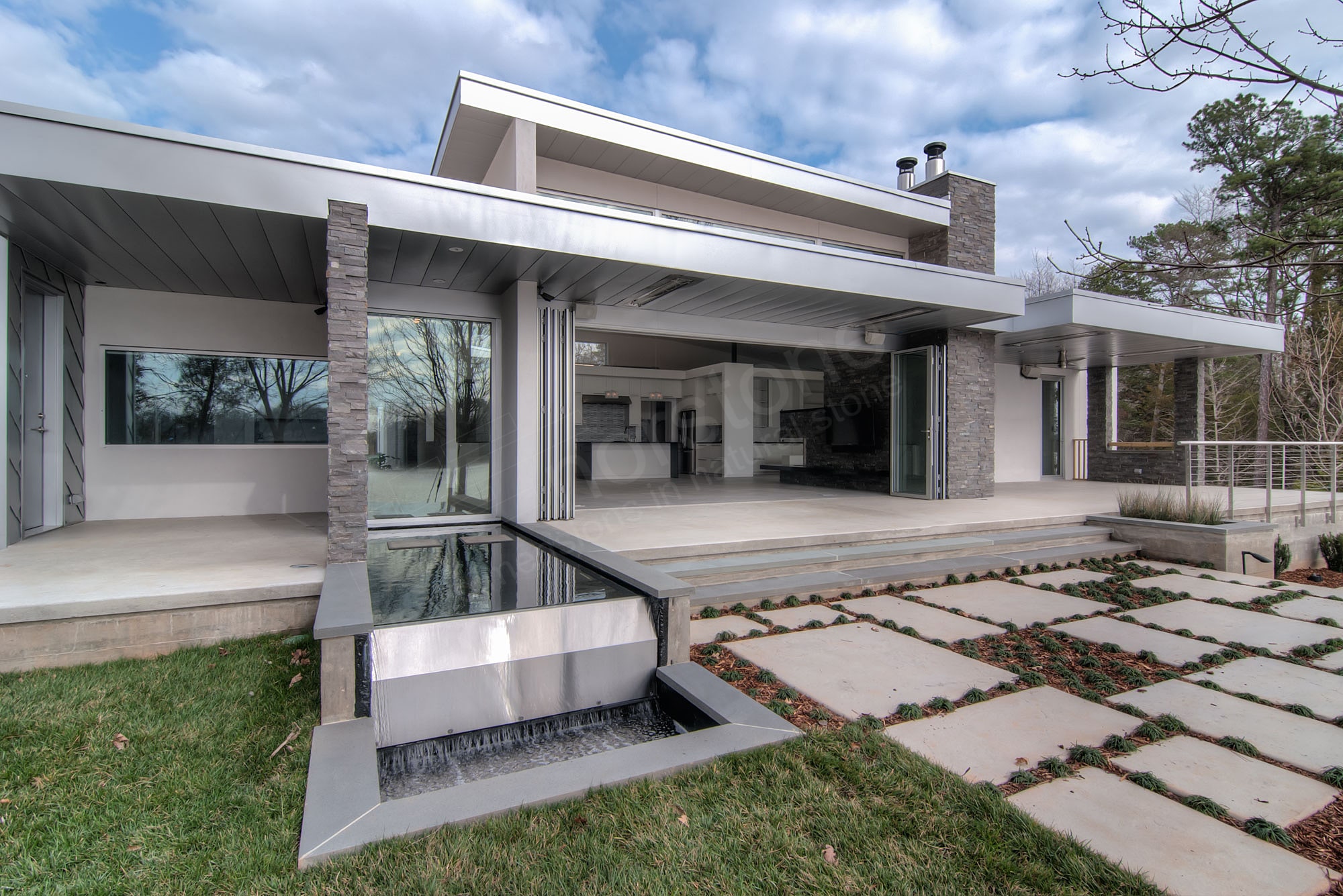 Norstone Charcaol XL Stacked Stone Rock Panels on Modern Mountain Home Backyard